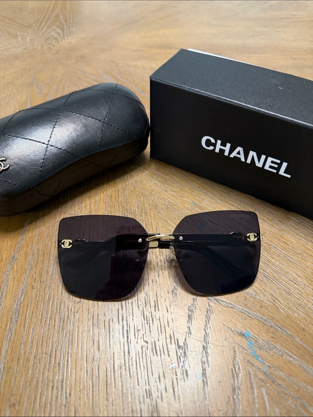 CHANEL Rimless Square Sunglasses in Black with Gold Accents